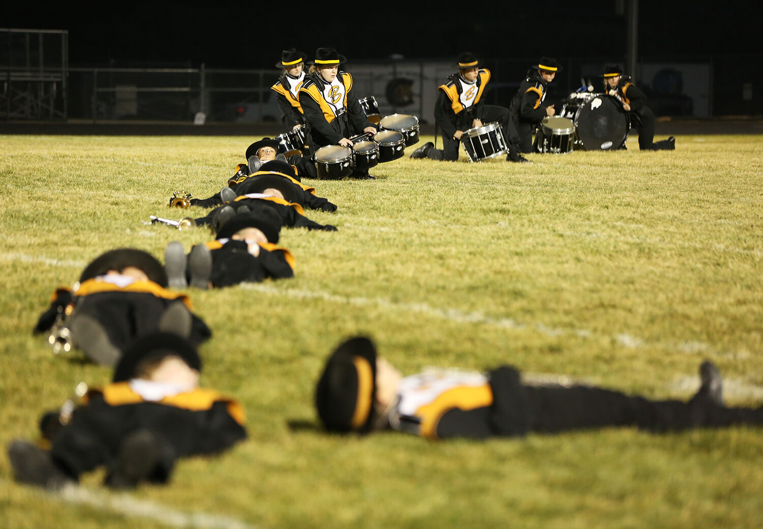 All members of the band that can lay down flat on their backs